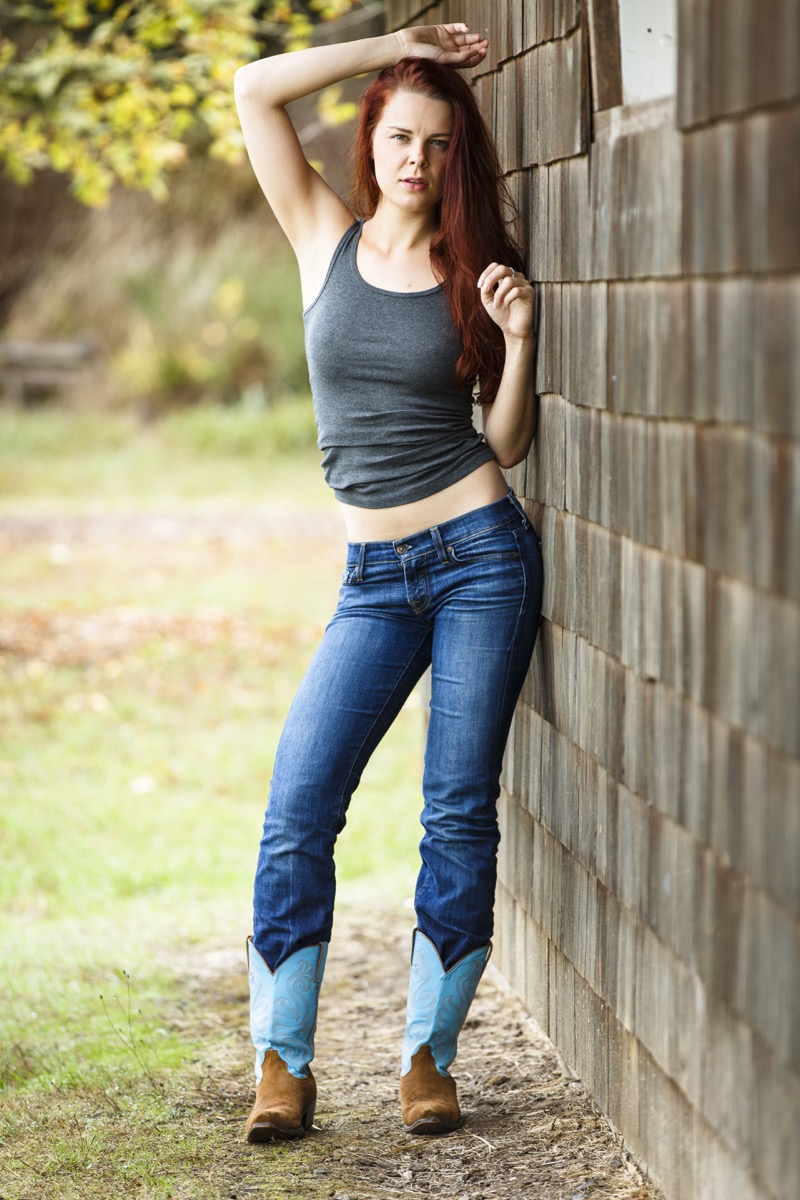 Woman wearing low-rise jeans and cowboy boots