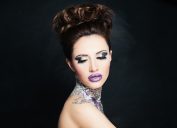 woman wearing fake eyelashes and tacky glittery bright makeup