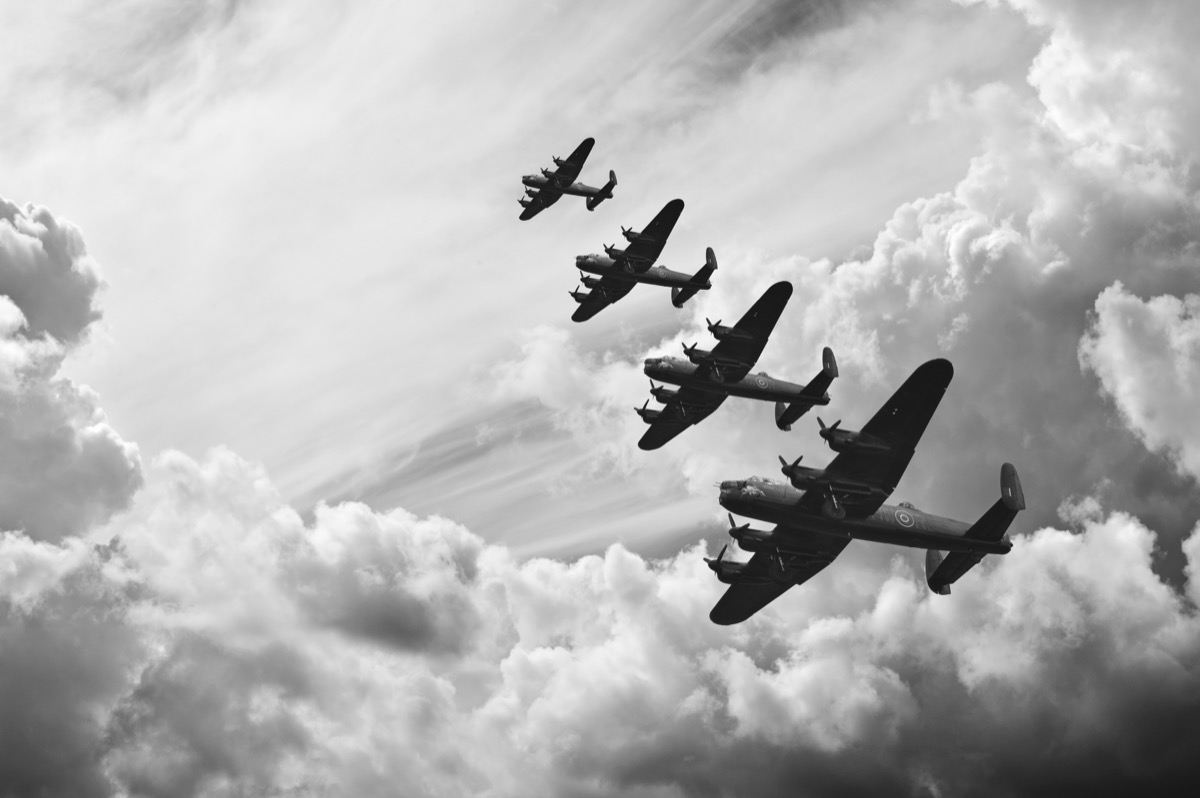 Black and white retro image of four bomber planes in the sky, state fact about washington