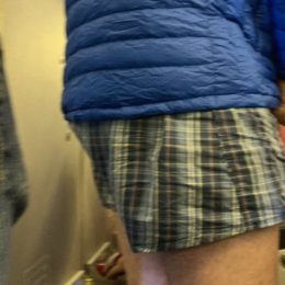 man takes off pants on long flight