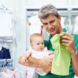 A Baby and Father Shopping for Clothes {Save Money on Kids' Clothes}