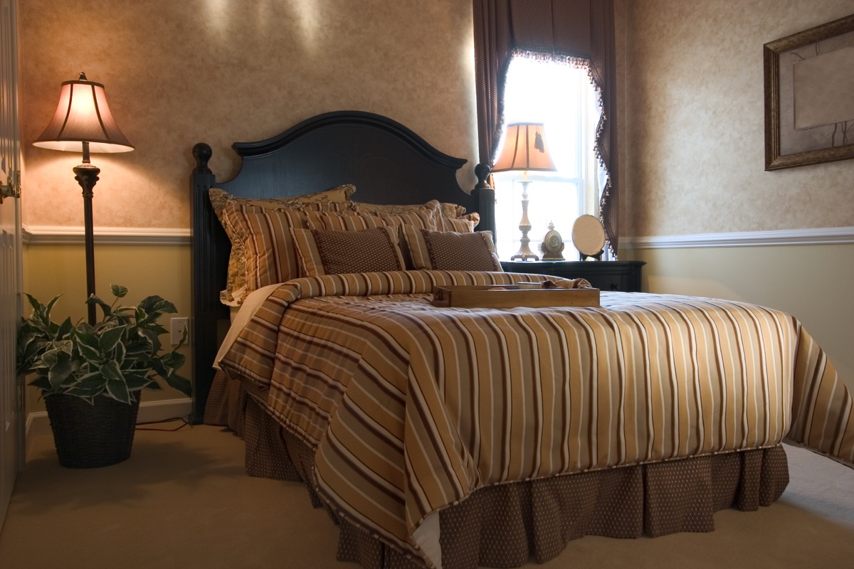 brown bedroom with bedskirt