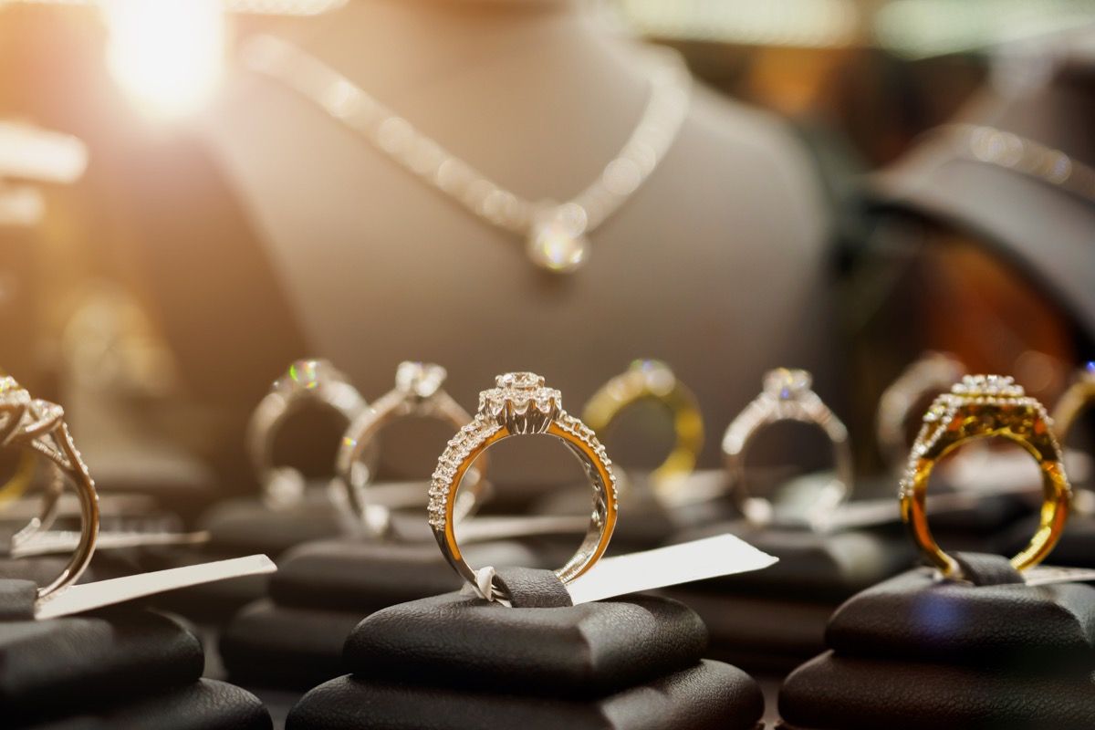 Jewelry diamond rings and necklaces show in luxury retail store window display showcase - Image