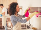 couple spring cleaning their kitchen, easy home tips