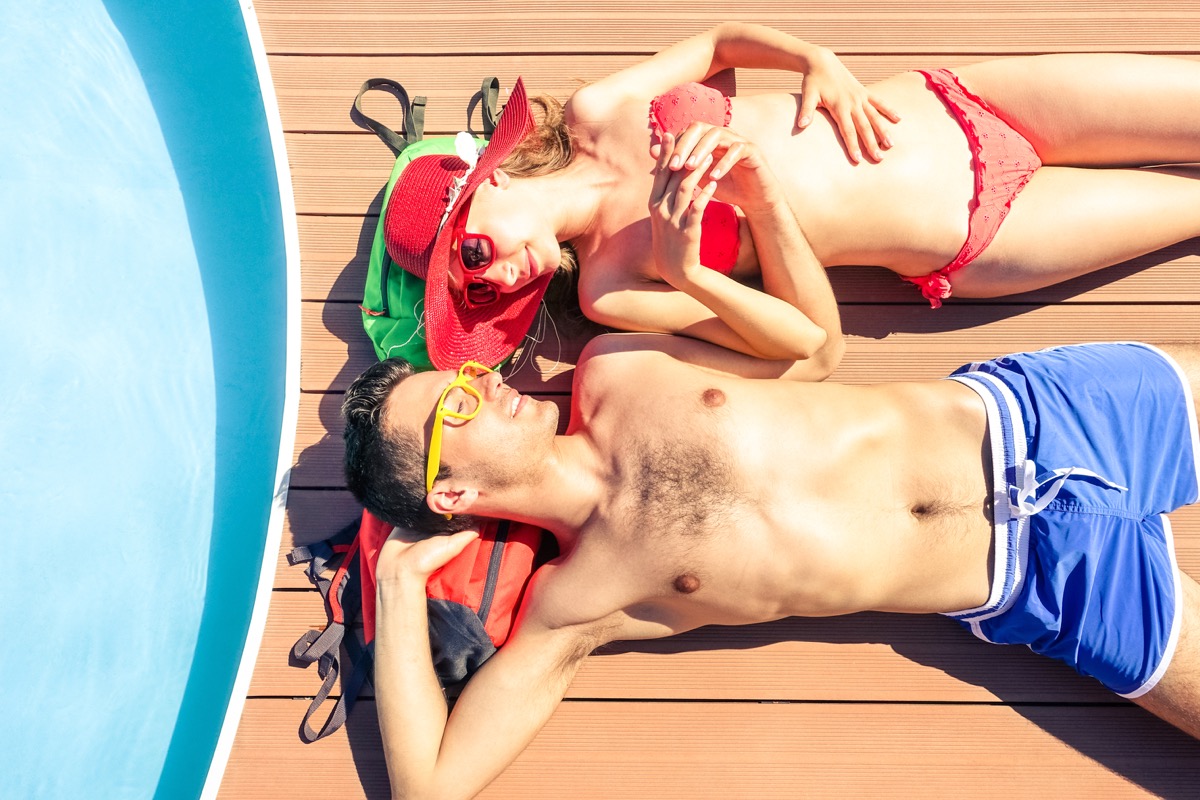 Couple sunbathing on cruise ship deck cruise ship facts