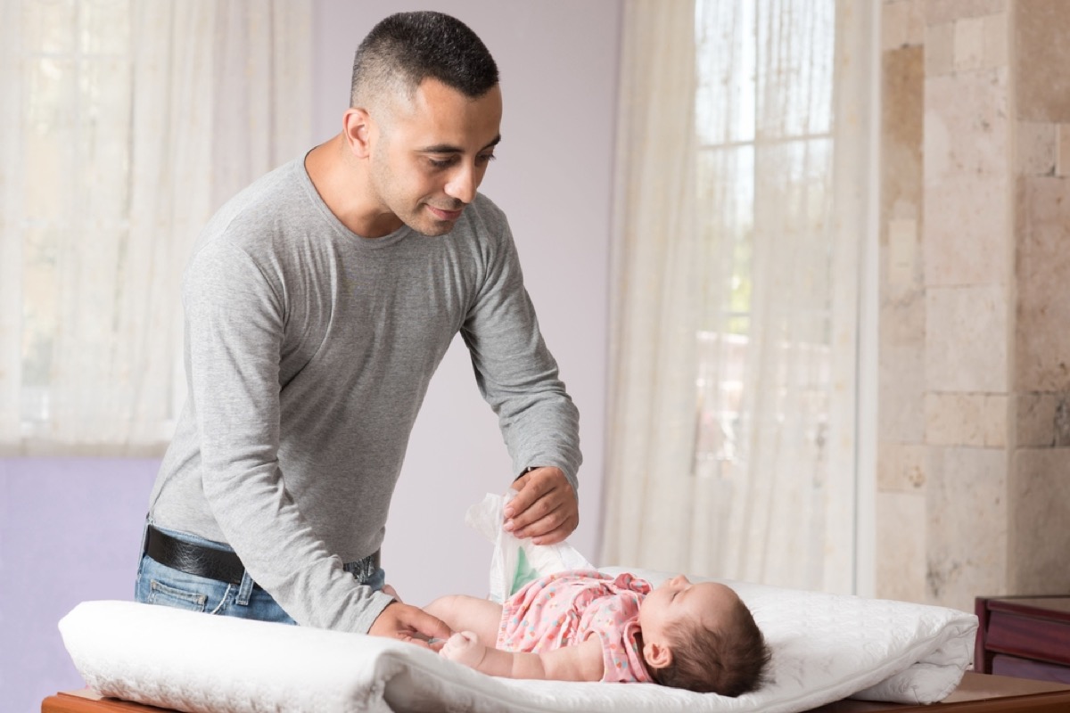 father changing diaper, things you should never say to your spouse
