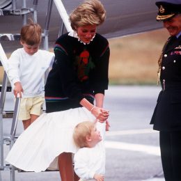 Diana and William and Harry getting off an airplane