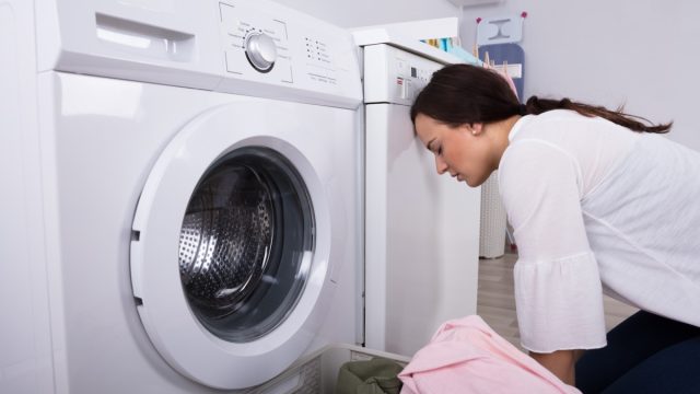 frustrated woman doing laundry