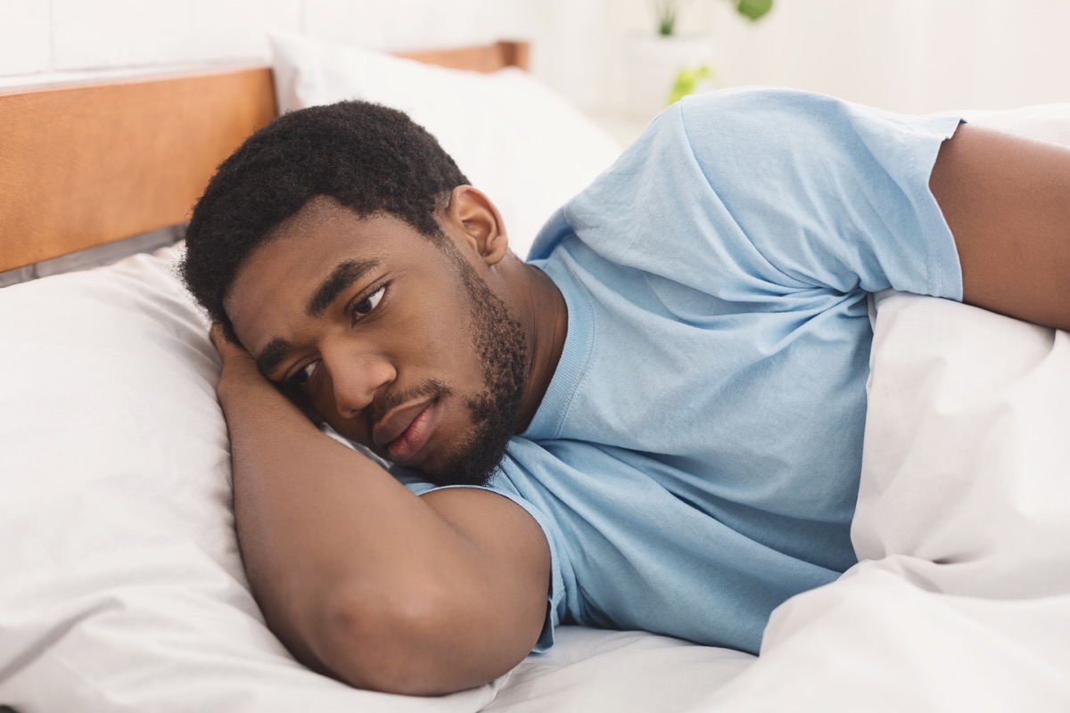 Man Lying Awake in Bed Because He Can't Sleep, bad parenting advice