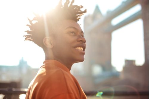 happy young man smiling in the sun