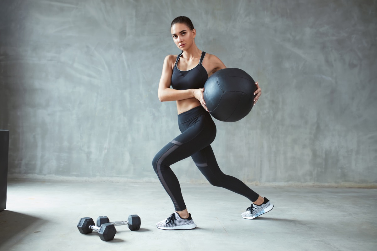 Woman In Stylish Sports Wear Training With Med Ball - Image