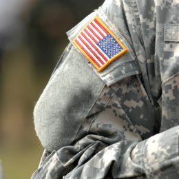 the american flag patch on a military uniform