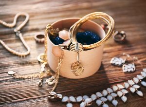 old jewelry on a wooden attic floor things to throw away
