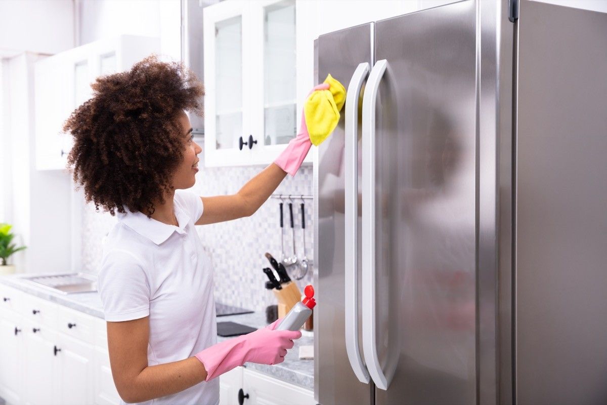 a woman with a refrigerator