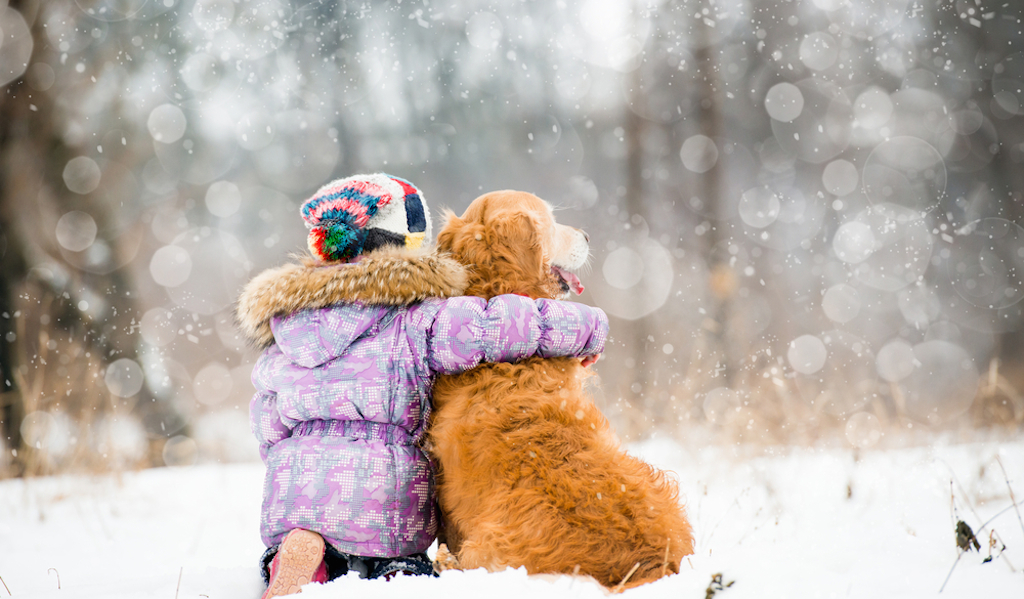 little girl hugging dog in winter things you never knew dogs could do