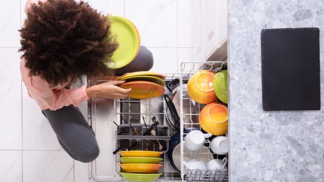 woman loading dishwasher,