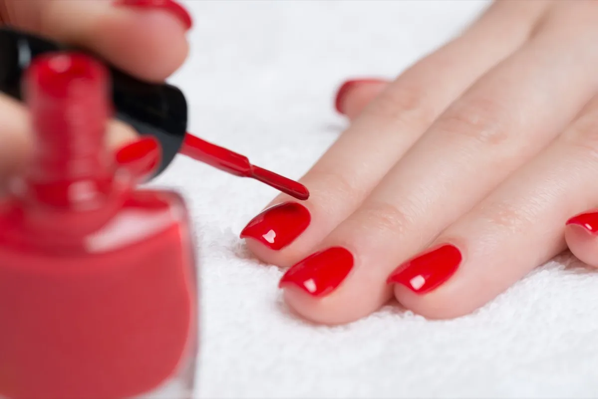 woman polishing nails