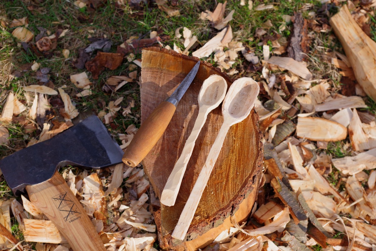 Wooden Spoon carving outside with Carpenter's Axe and Carving Knife - Image