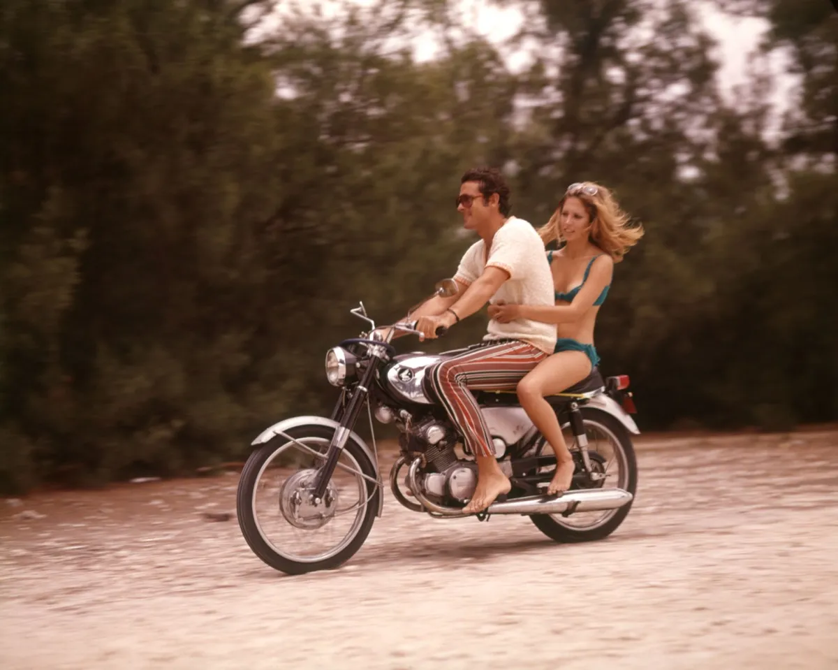 1970s couple rides motorcycle, cool grandparents
