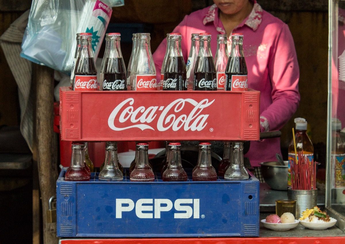 Woman selling Coke and Pepsi in Cambodia