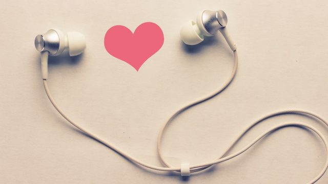 Earbuds against heart backdrop