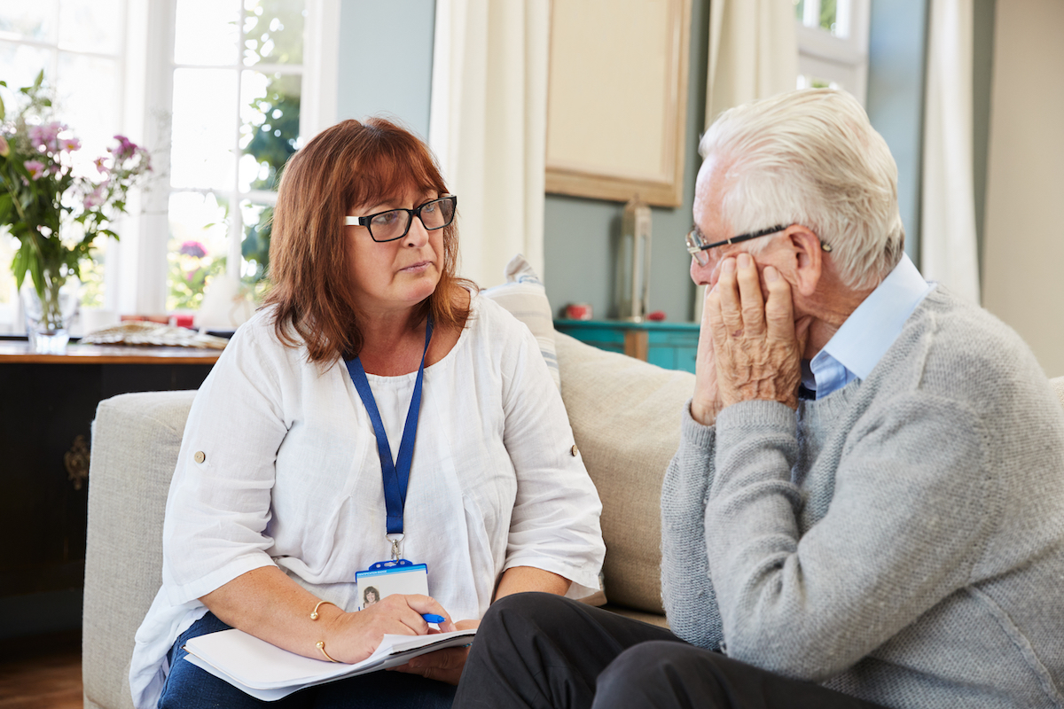 Older man with grief counselor