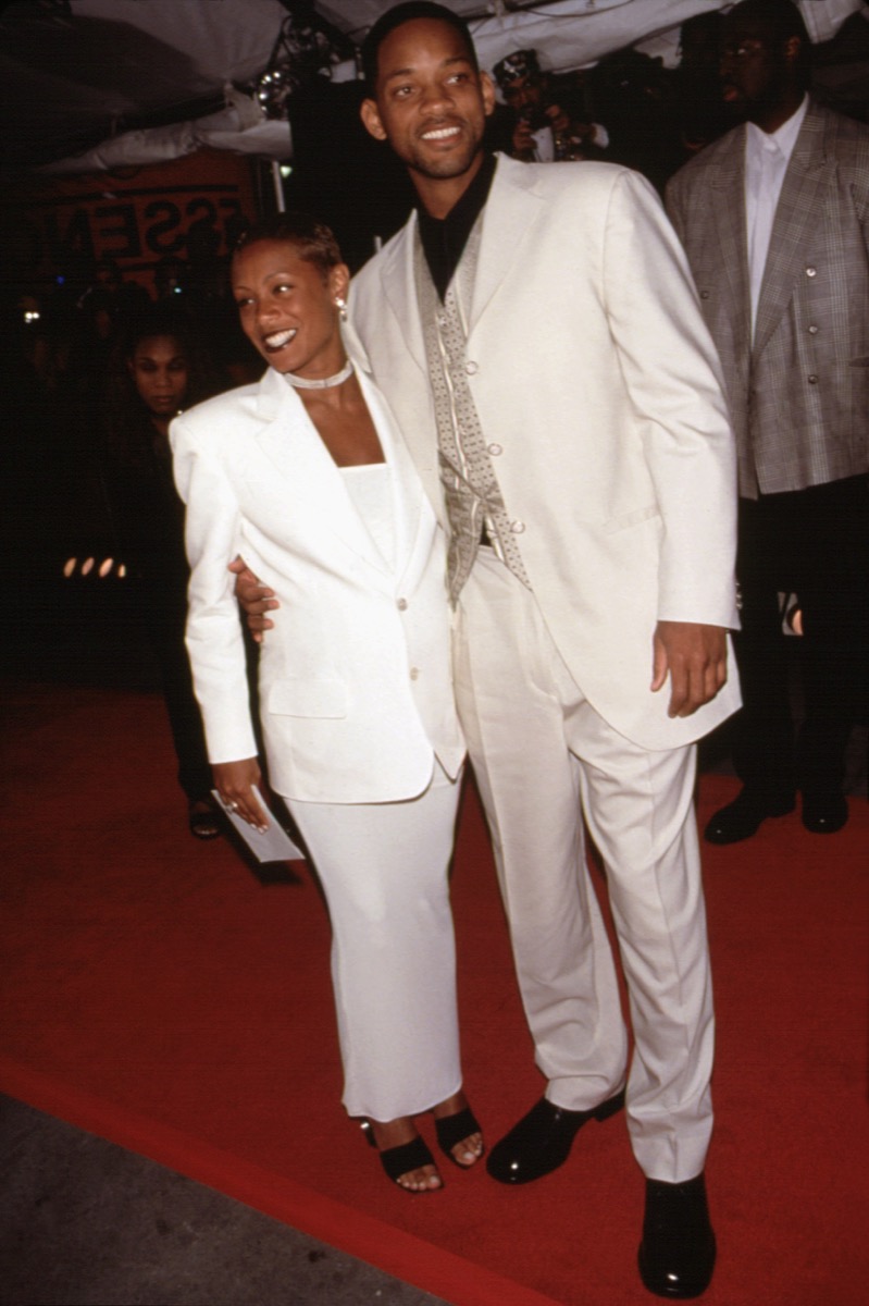Celebrities Will Smith and Jada Pinkett Smith wear matching white suits to the Essence Awards in 1998