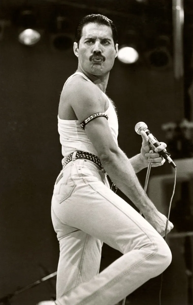 Freddie Mercury on stage and triumphant at Live Aid concert in July 1985