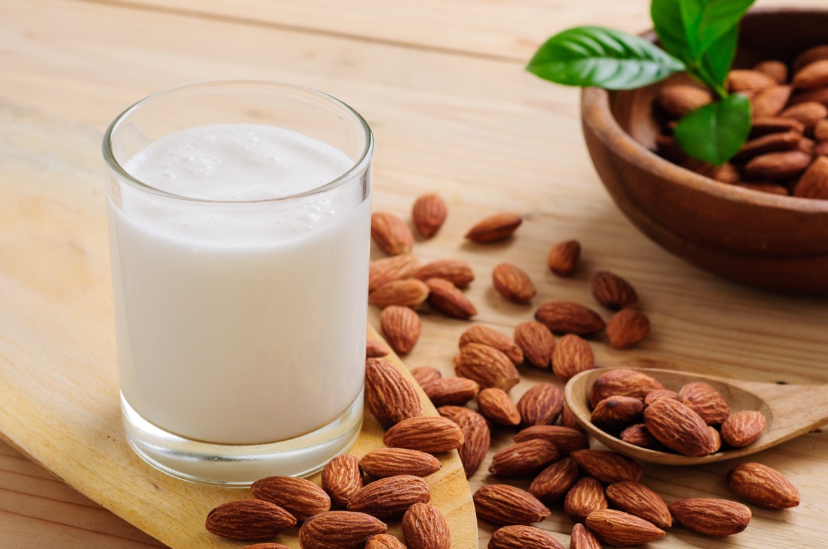 A Glass of Almond Milk Surrounded by Almonds