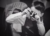 boy using a disposable camera