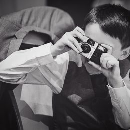 boy using a disposable camera
