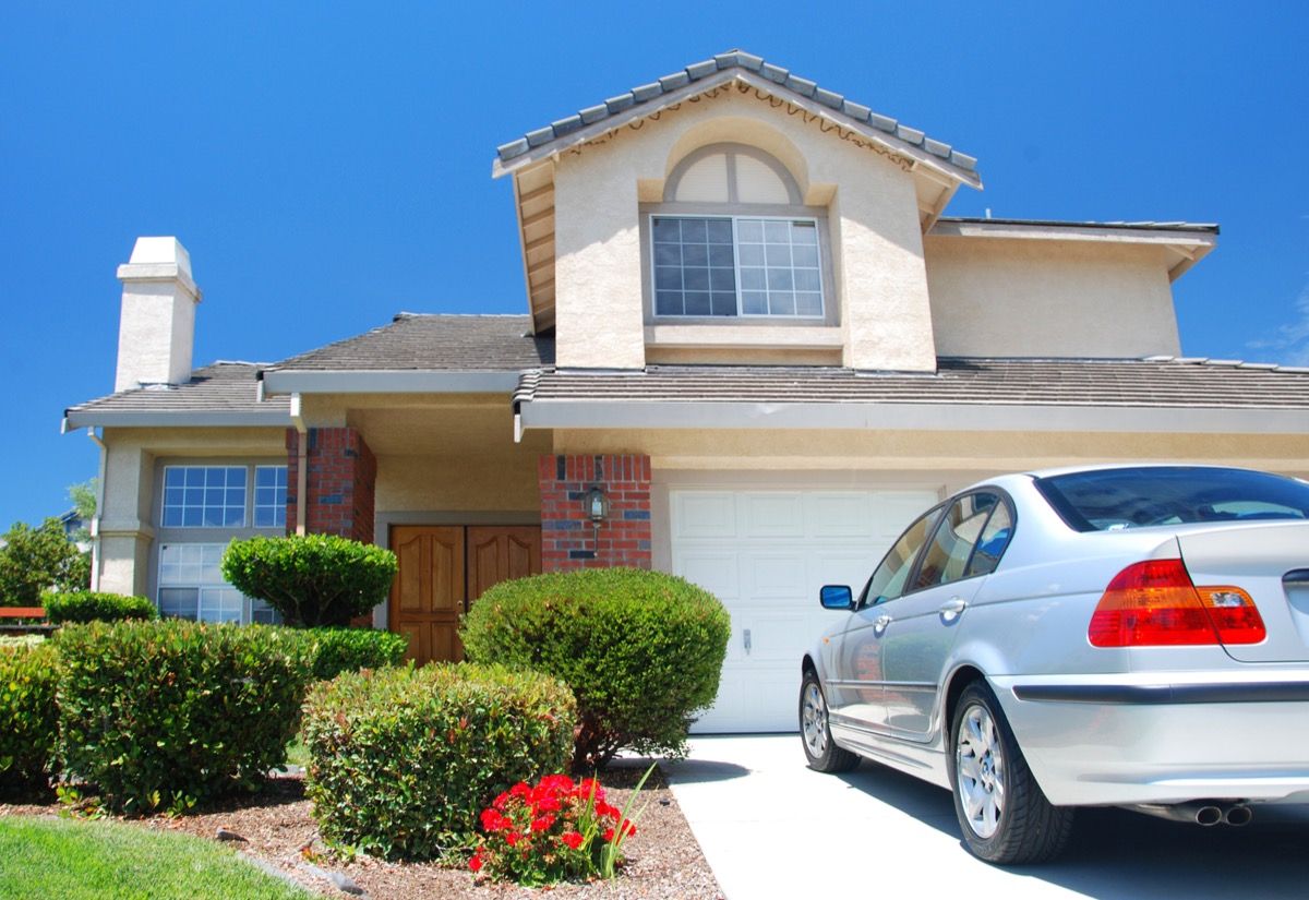 luxury car outside house