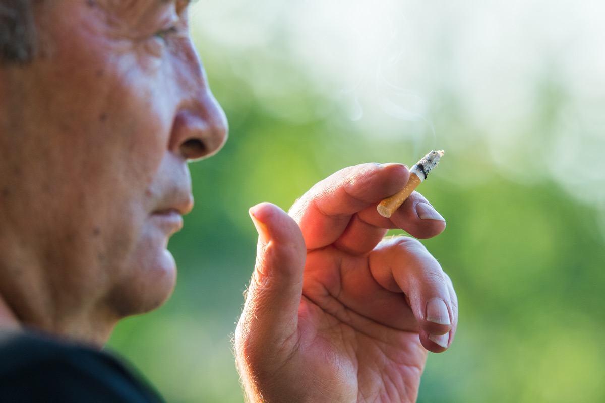 An Older Man Smoking a Cigarette