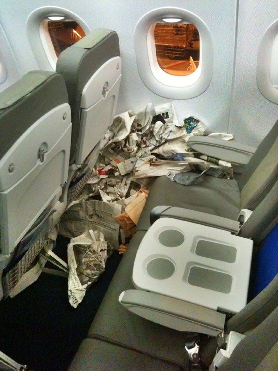 Newspaper on airplane photos of terrible airplane passengers