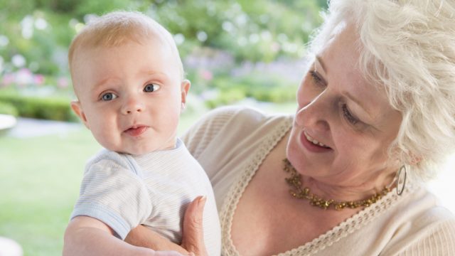 older woman holding grandchild things grandparents should never do