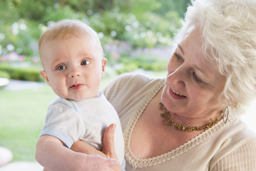 older woman holding grandchild things grandparents should never do