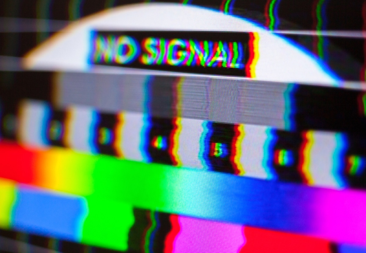 close up of no signal and color bars on a tv screen