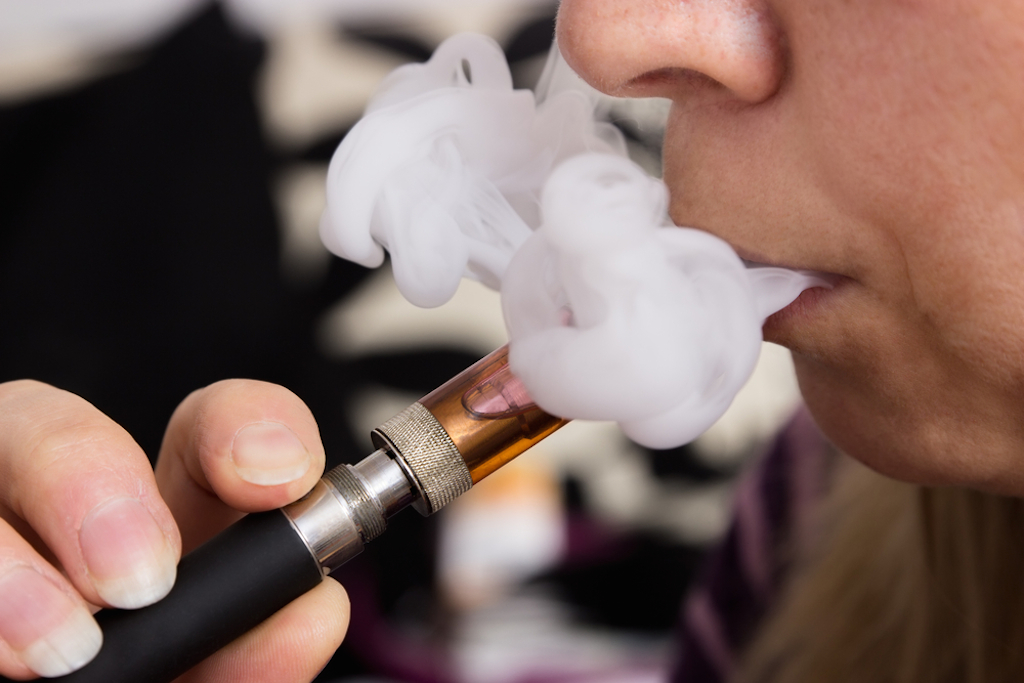 Person Smoking an E-Cigarette Habits That Horrify Physician