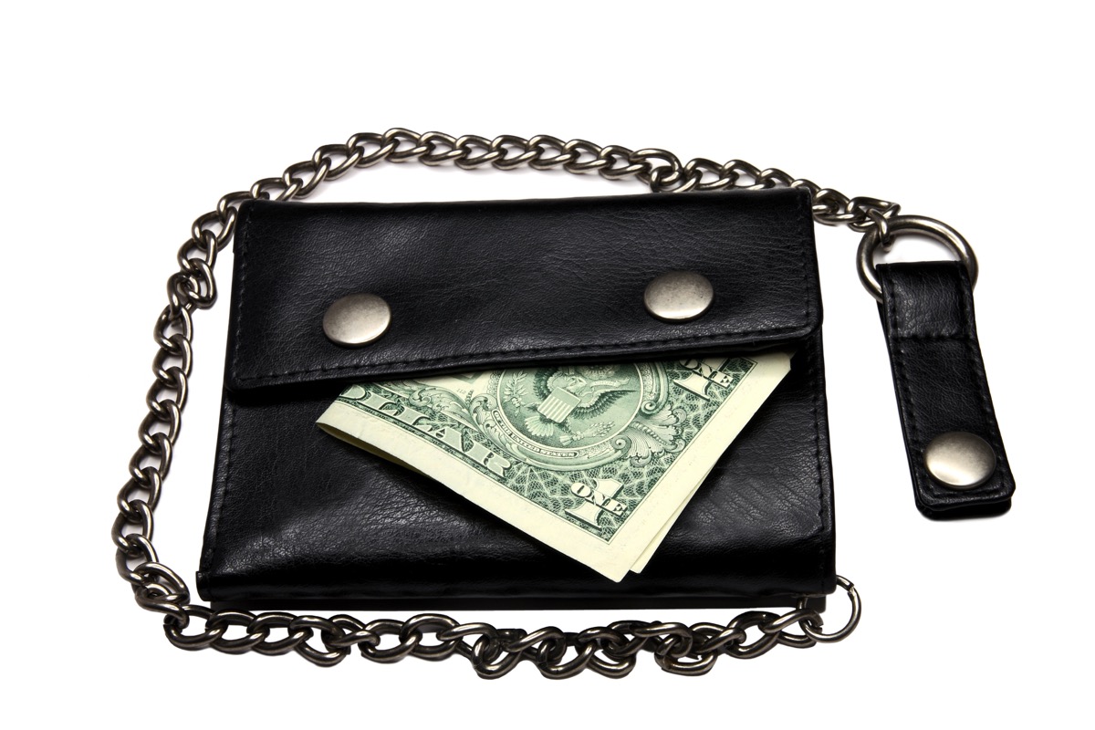 black wallet with chain and one dollar inside, a 90s fashion trend