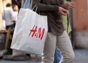 close up of h&m bag being carried by a man