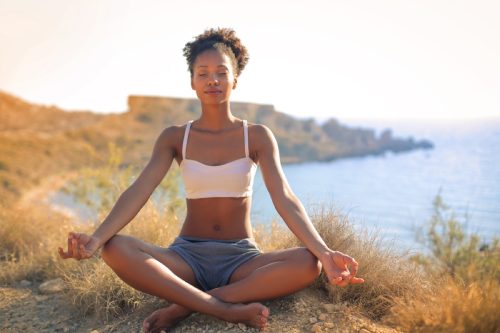 black woman doing yoga
