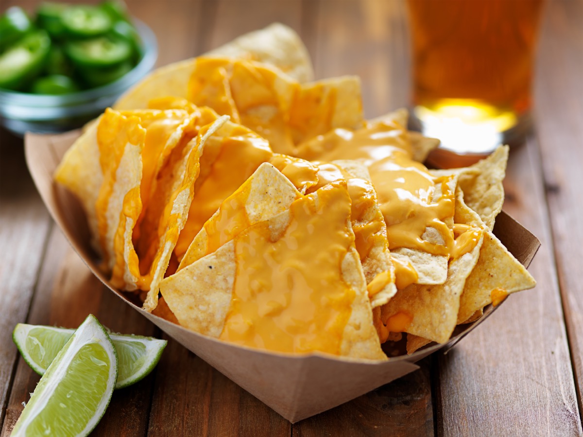 tortilla chips covered in nacho cheese because technically speaking they are nachos