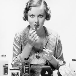 woman applying makeup old beauty products