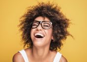 woman laughing on gold background, what do you call jokes