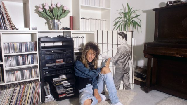 woman in the 1980s near her entertainment and tv center