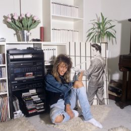 woman in the 1980s near her entertainment and tv center