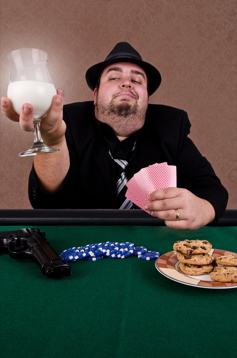 A Man Playing Poker With a Glass of Milk Funny Stock Photos