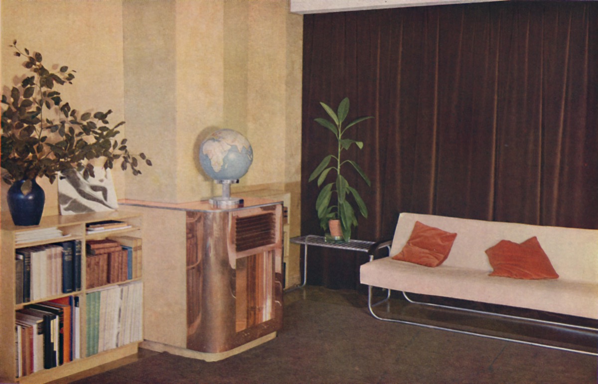A Living Room With a Fake Plant 1990s Home Decor
