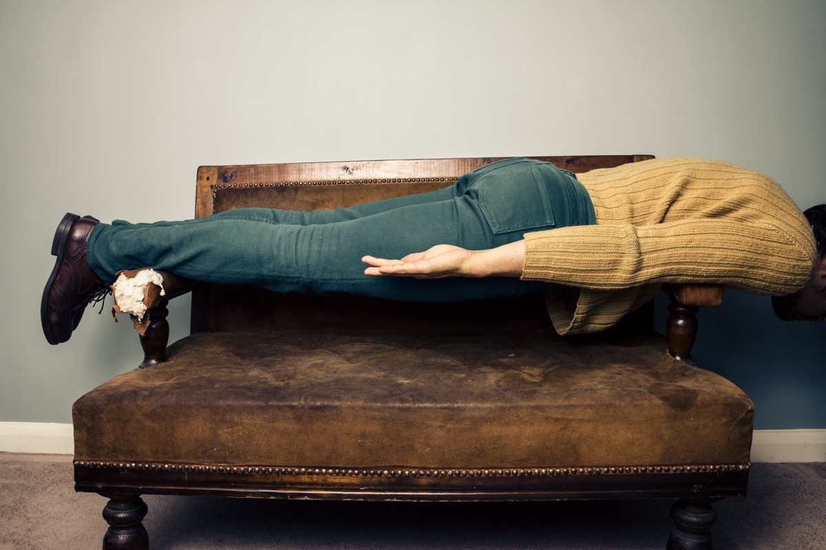 Man Planking on a Piece of Furniture Funny Stock Photos