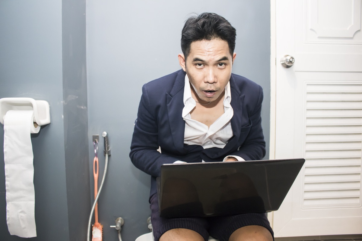 Businessman Using His Computer From the Bathroom Funny Stock Photos